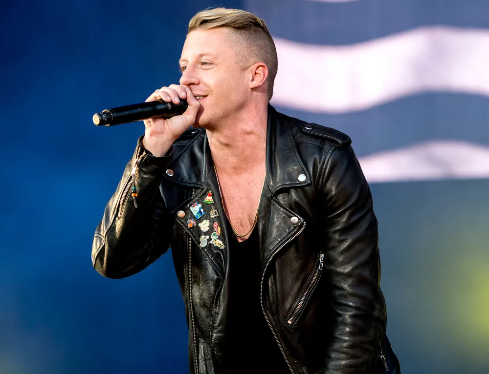 Macklemore of Macklemore & Ryan Lewis performs on stage at Leeds Festival at Bramham Park on August 22, 2014 in Leeds, United Kingdom.