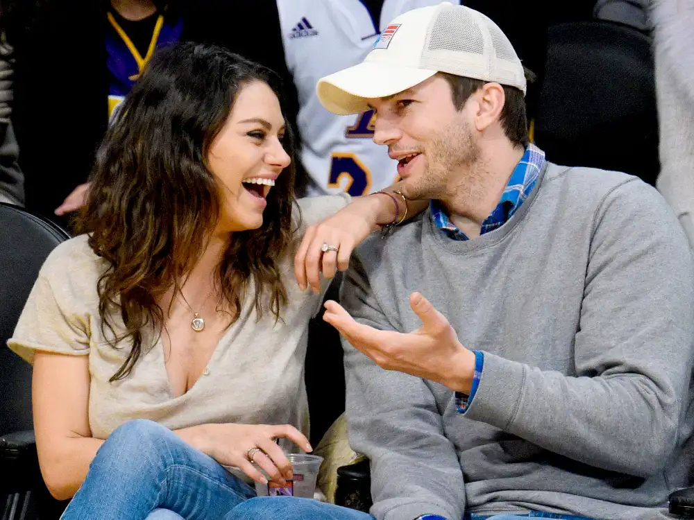Mila Kunis and Ashton Kutcher attend a basketball game between the Oklahoma City Thunder and the Los Angeles Lakers at Staples Center on December 19, 2014 in Los Angeles, California.
