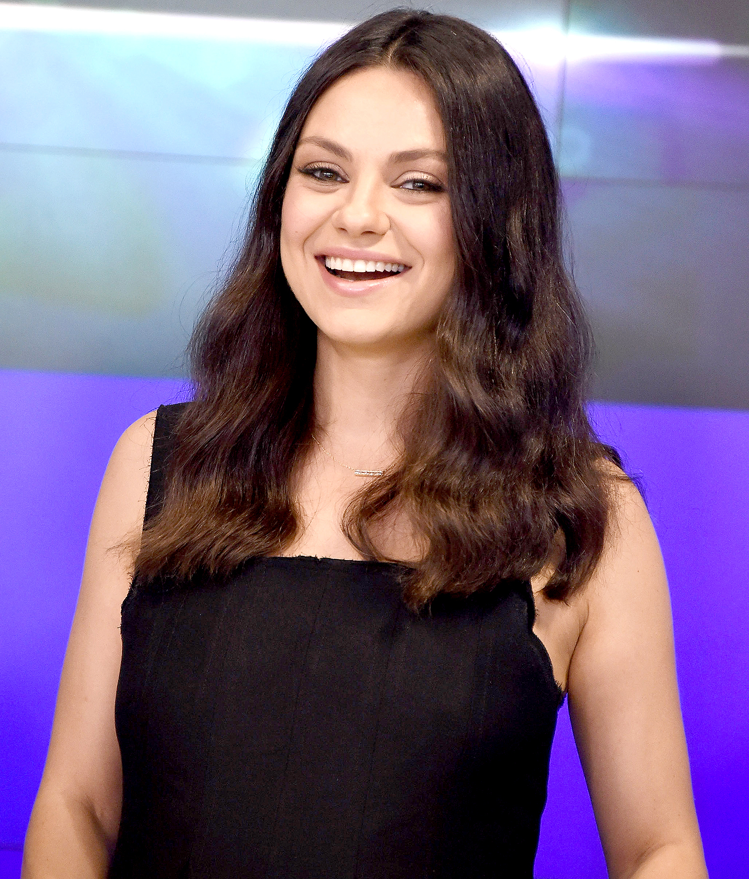 Mila Kunis rings the closing bell at NASDAQ on July 28, 2016 in New York City.