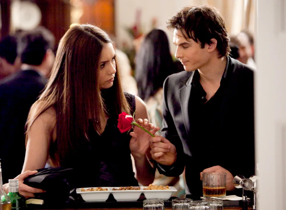 Nina Dobrev as Elena and Ian Somerhalder as Damon