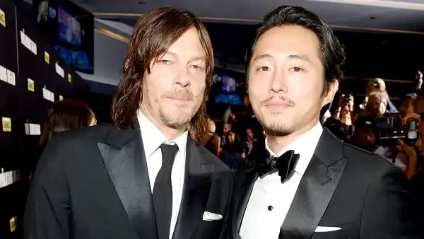 Norman Reedus and Steven Yeun attend AMC's "The Walking Dead" season 6 fan premiere event at Madison Square Garden on October 9, 2015 in New York City.