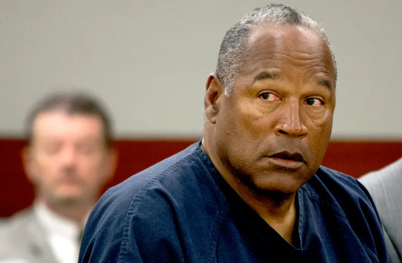 O.J. Simpson listens as his defense attorney, Ozzie Fumo, questions witness David Cook during an evidentiary hearing in Clark County District Court May 16, 2013 in Las Vegas, Nevada. Julie Jacobson-Pool/Getty Images