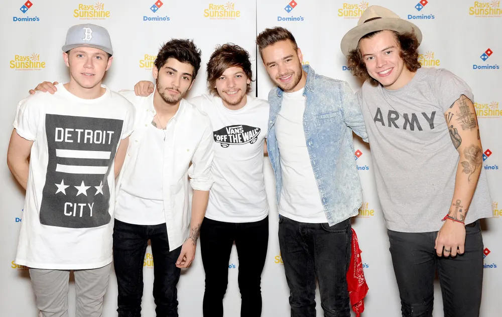 Zayn Malik, Niall Horan, Louis Tomlinson, Liam Payne and Harry Styles of One Direction pose for photographs at Wembley Arena as they made the wishes of 60 seriously ill children come true and met the children prior to performing at Wembley Stadium on June 8, 2014 in London, United Kingdom.