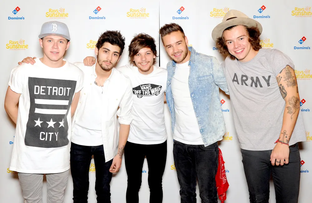 Zayn Malik, Niall Horan, Louis Tomlinson, Liam Payne and Harry Styles of One Direction pose for photographs at Wembley Arena as they made the wishes of 60 seriously ill children come true and met the children prior to performing at Wembley Stadium on June 8, 2014 in London, United Kingdom.