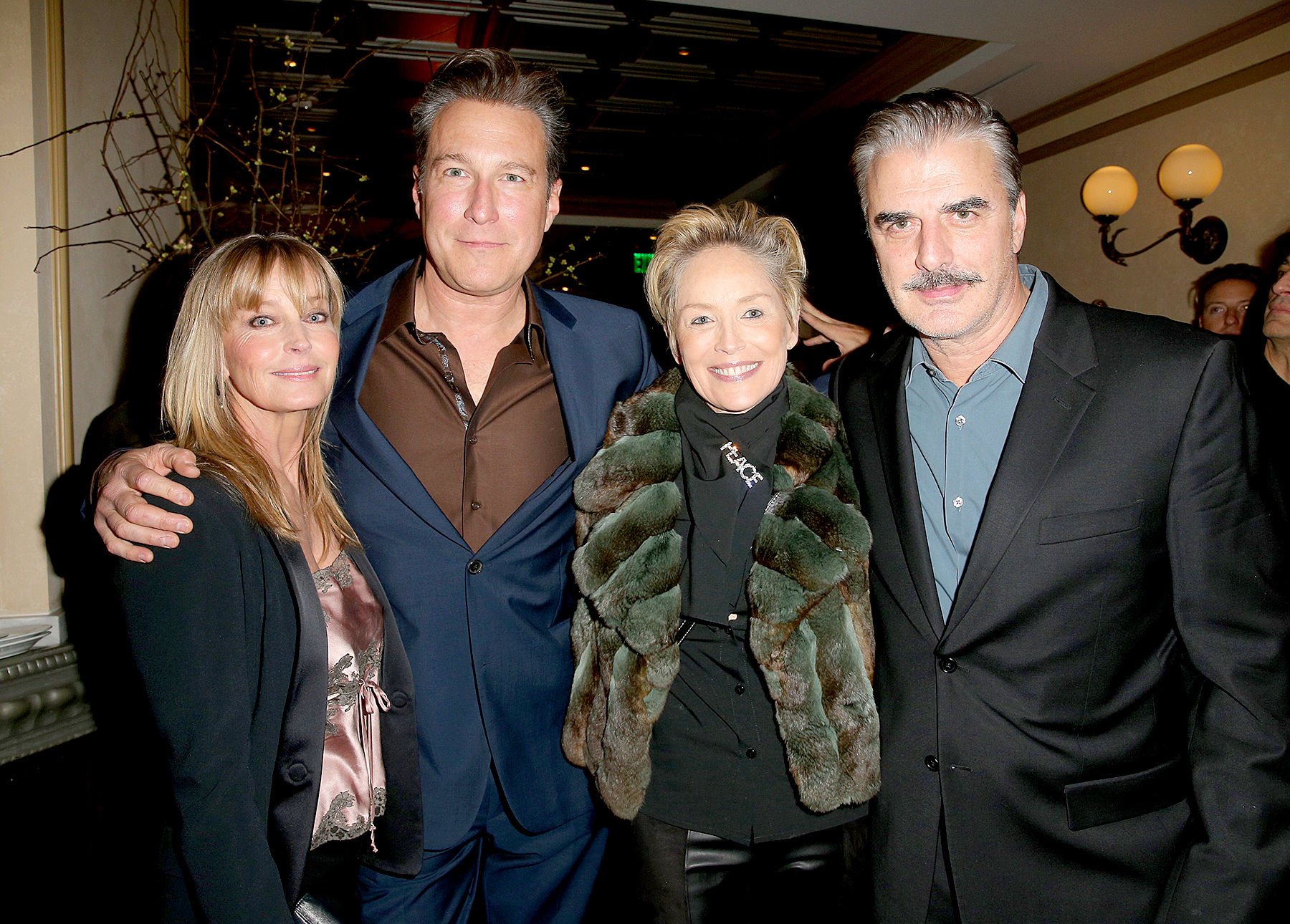 Chris Noth and John Corbett, along with Bo Derek and Sharon Stone, at a pre-Golden Globe celebration for the film Spotlight at Bouchon in Beverly Hills.