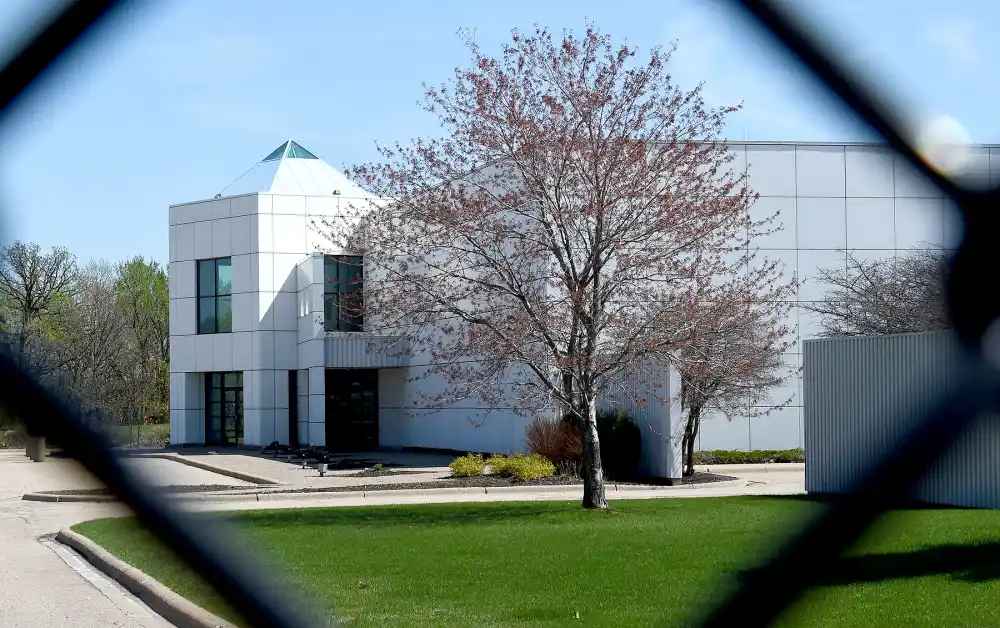 The entrance of the Paisley Park compound of music legend Prince is seen through a fence in Minneapolis, Minnesota, on April 22, 2016.
