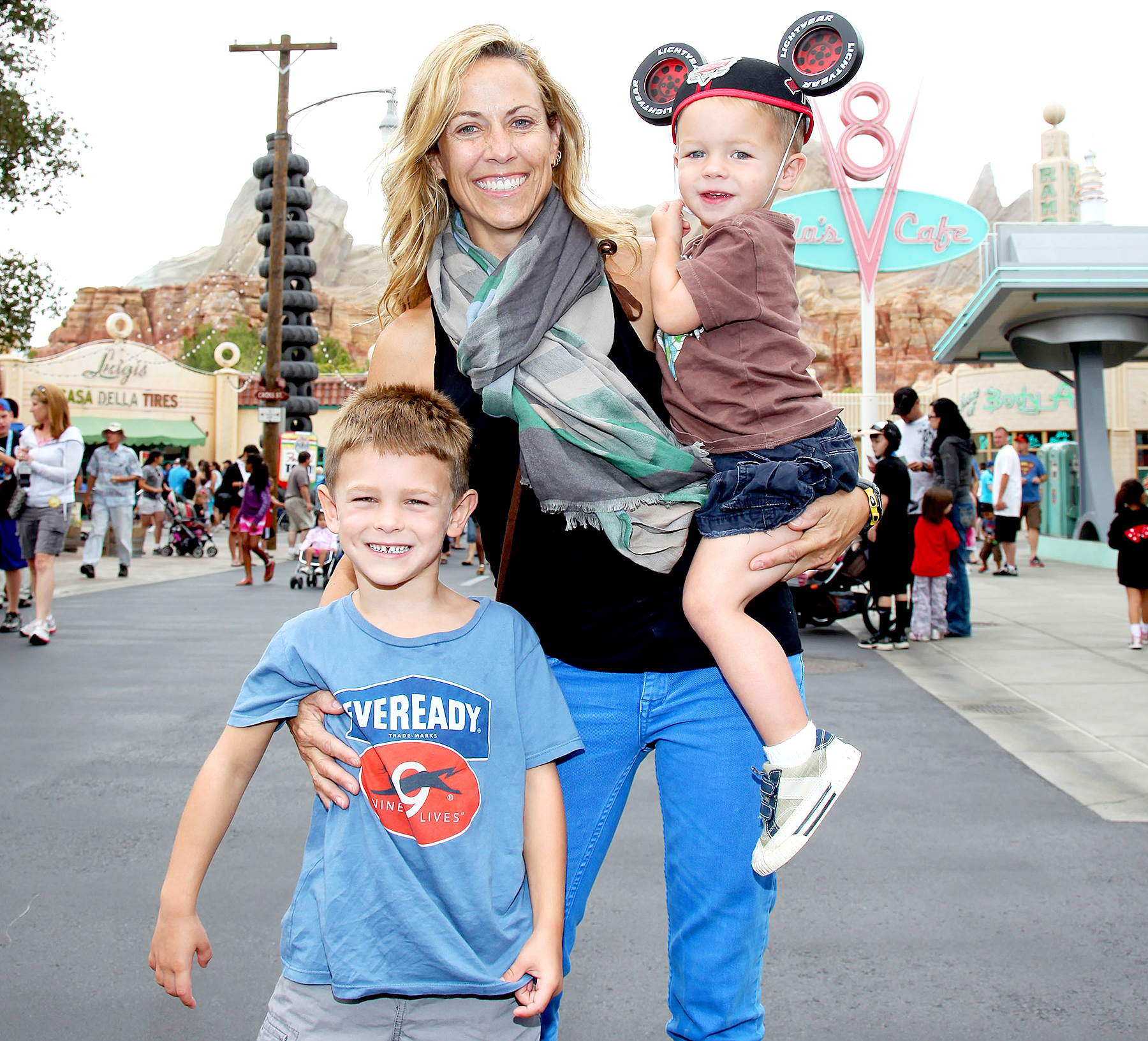 Sheryl Crow and her sons, Wyatt, 5 (left) and Levi, 2, pose at Cars Land in Disney California Adventure park on July 25, 2012 in Anaheim, California.