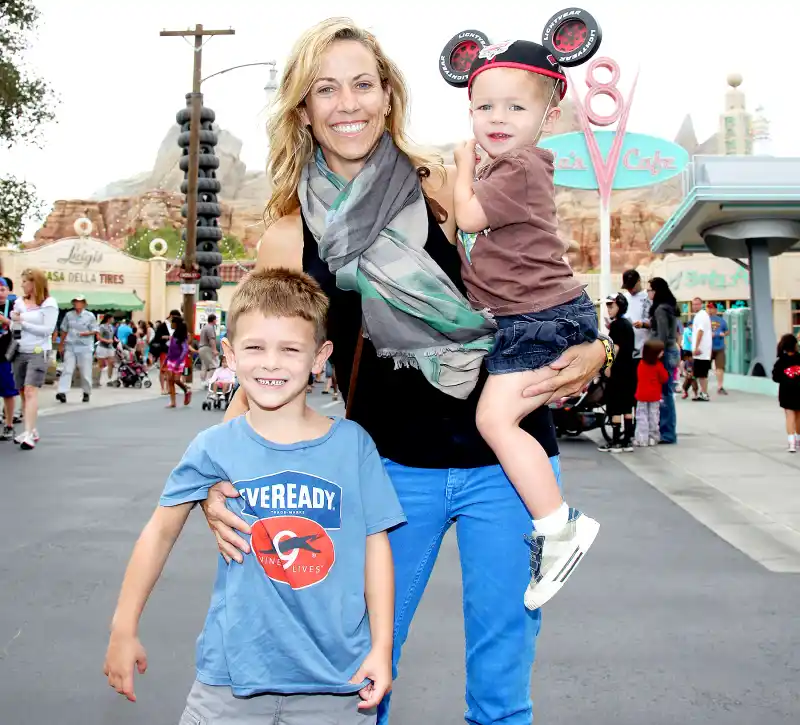 Sheryl Crow and her sons, Wyatt, 5 (left) and Levi, 2, pose at Cars Land in Disney California Adventure park on July 25, 2012 in Anaheim, California.