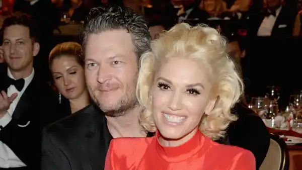 Gwen Stefani and Blake Shelton cuddle up at Clive Davis' pre-Grammys 2016 party