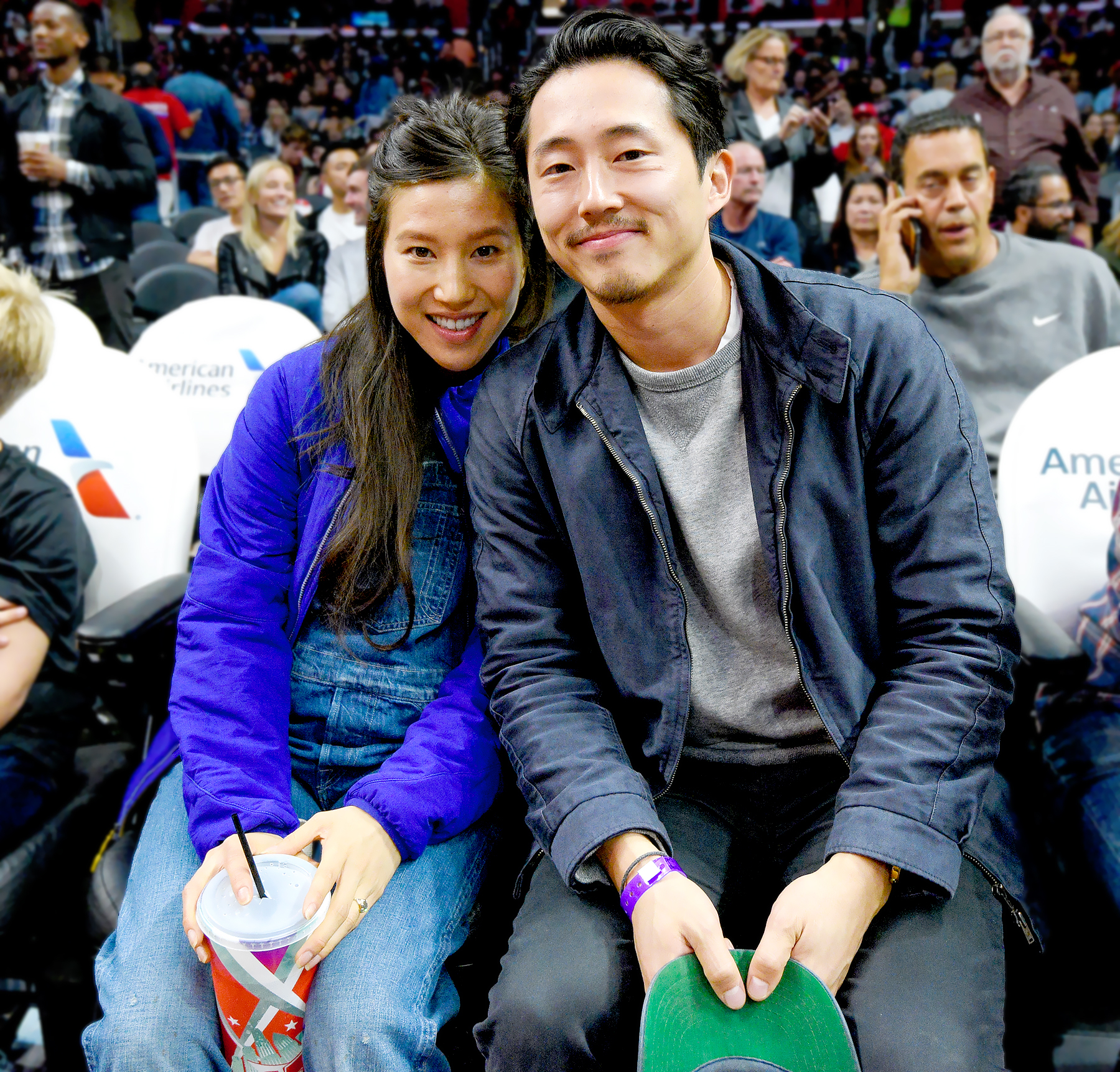 Steven Yeun (R) and Joana Pak attend a basketball game between the Detroit Pistons and the Los Angeles Clippers at Staples Center on November 7, 2016 in Los Angeles, California.