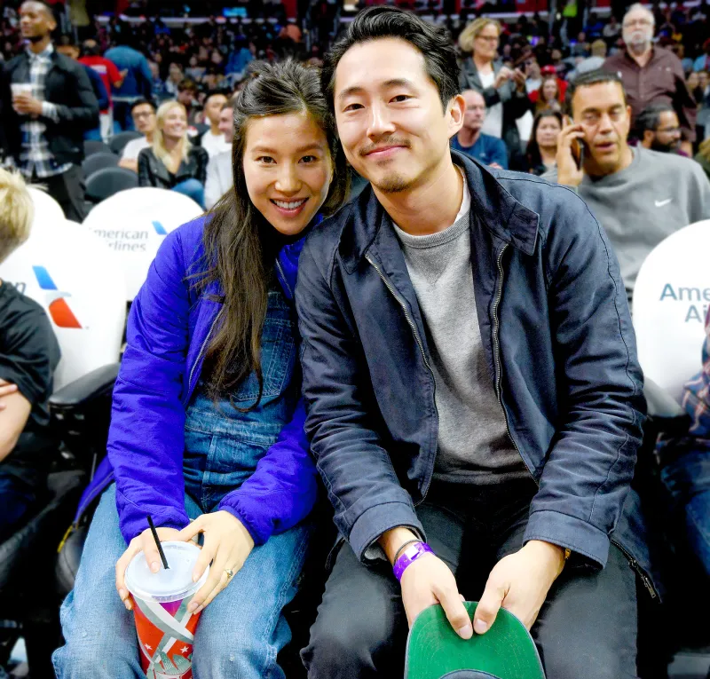 Steven Yeun (R) and Joana Pak attend a basketball game between the Detroit Pistons and the Los Angeles Clippers at Staples Center on November 7, 2016 in Los Angeles, California.