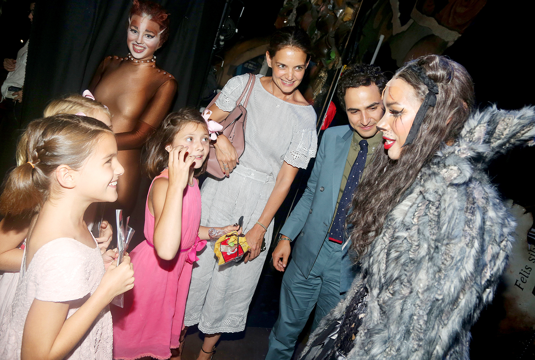 Suri Cruise, guest, Emily Pynenberg as "Cassandra", Katie Holmes, Zac Posen, Leona Lewis as "Grizabella The Glamour Cat" chat backstage at the hit musical "Cats" on Broadway at The Neil Simon Theatre on August 16, 2016 in New York City.