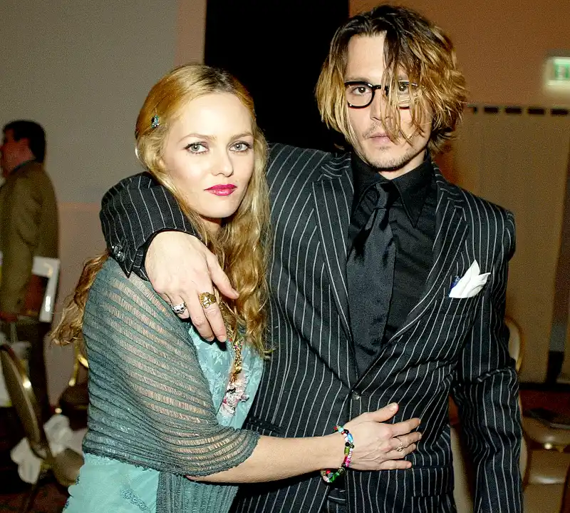Johnny Depp and Vanessa Paradis pose after The 9th Annual Critic's Choice Awards at the Beverly Hills Hotel on January 10, 2004 in Beverly Hills, California.