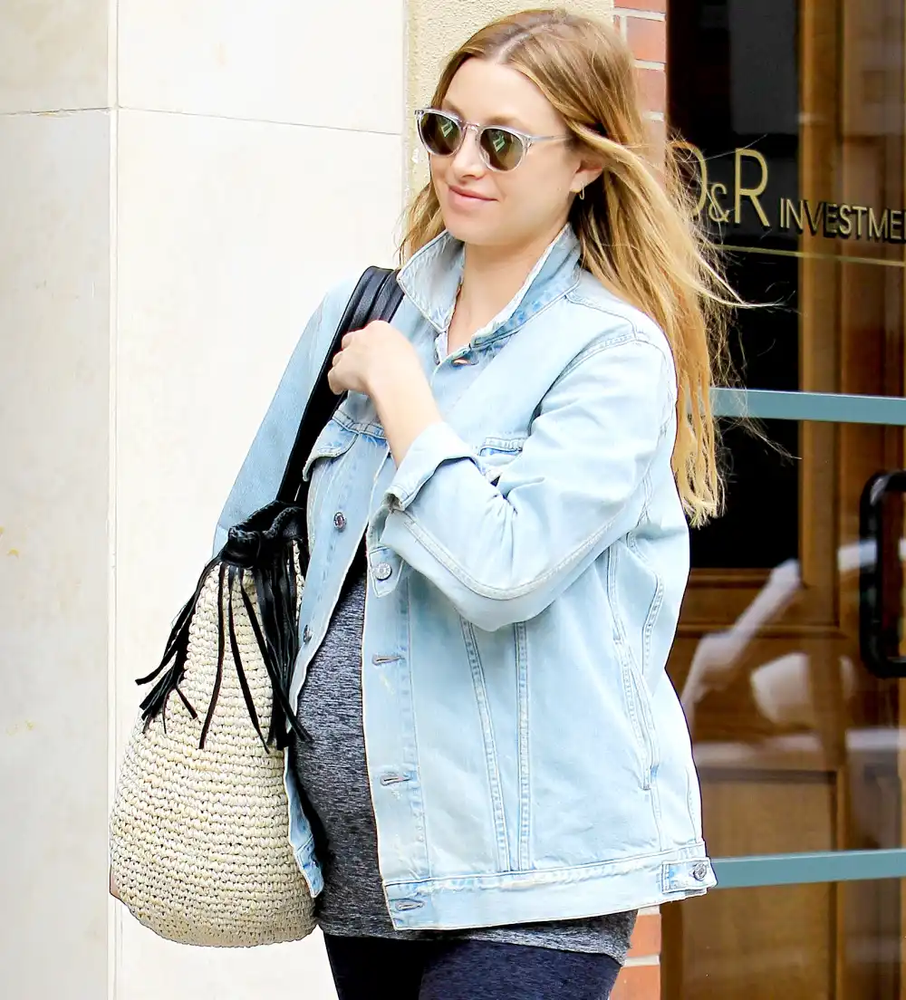 Make-up free Whitney Port debuts sizeable baby bump while getting a mani-pedi in May 2017.